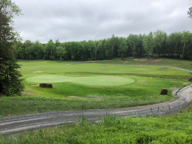 The number 13 green on June 14th, 2019. The green is in good condition.