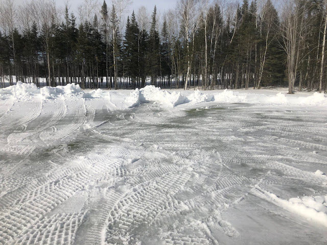 Another view of the cleared number 17 green, with a small layer of ice on top.